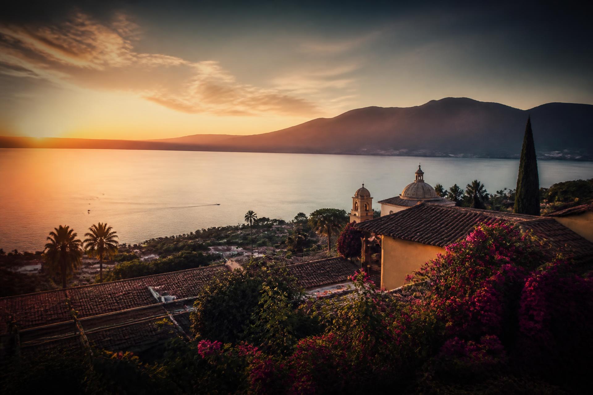 Sunset over Lake Chapala with the rooftops of Ajijic, Jalisco, Mexico